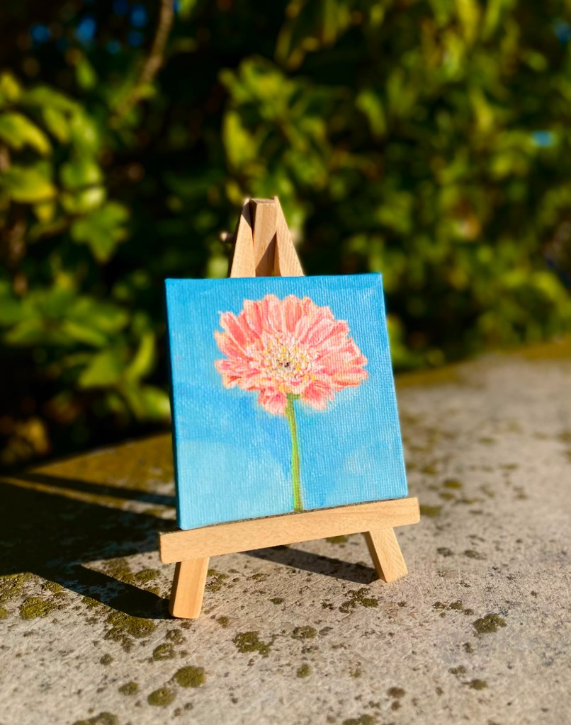 Obra de Meli Tozzi — flor sobre caballete